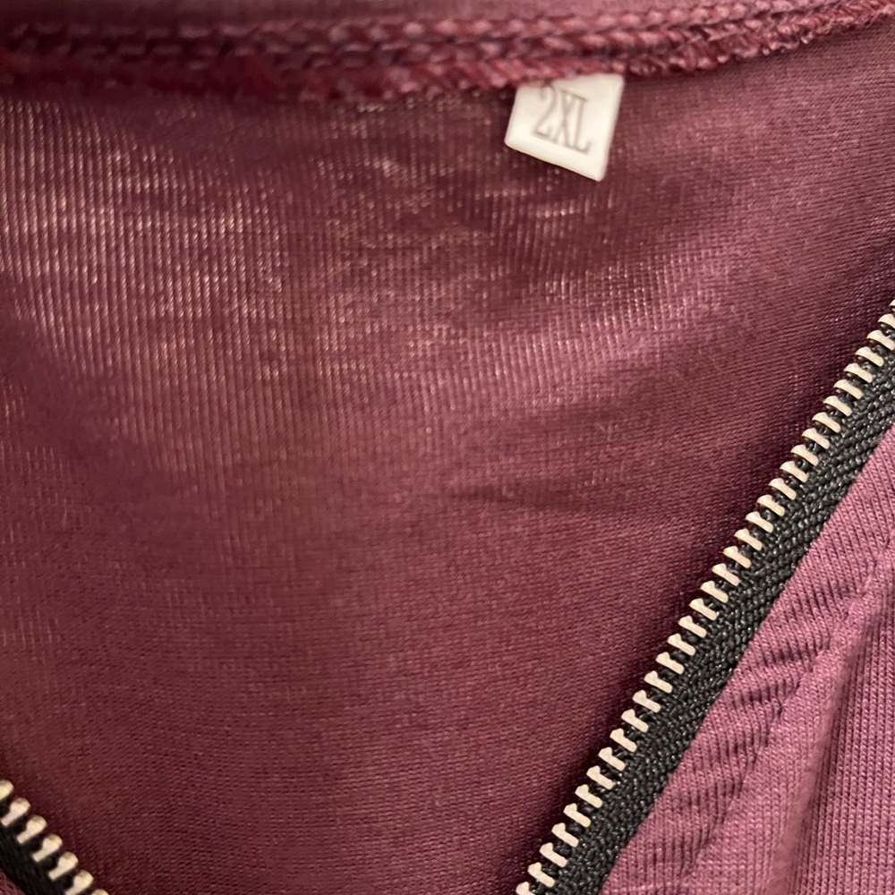 Boutique shorts jumpsuit.   Color is purple size 2x.